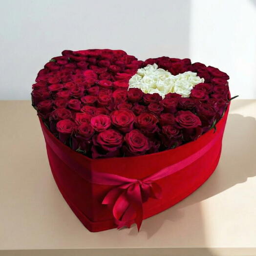 Heart-shaped box with red and white roses