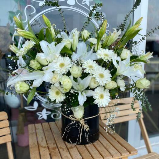 Lilies and gerberas in a black box