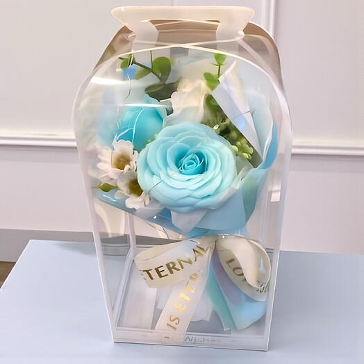 Işıklı kutuda mavi yapay çiçek kutusu